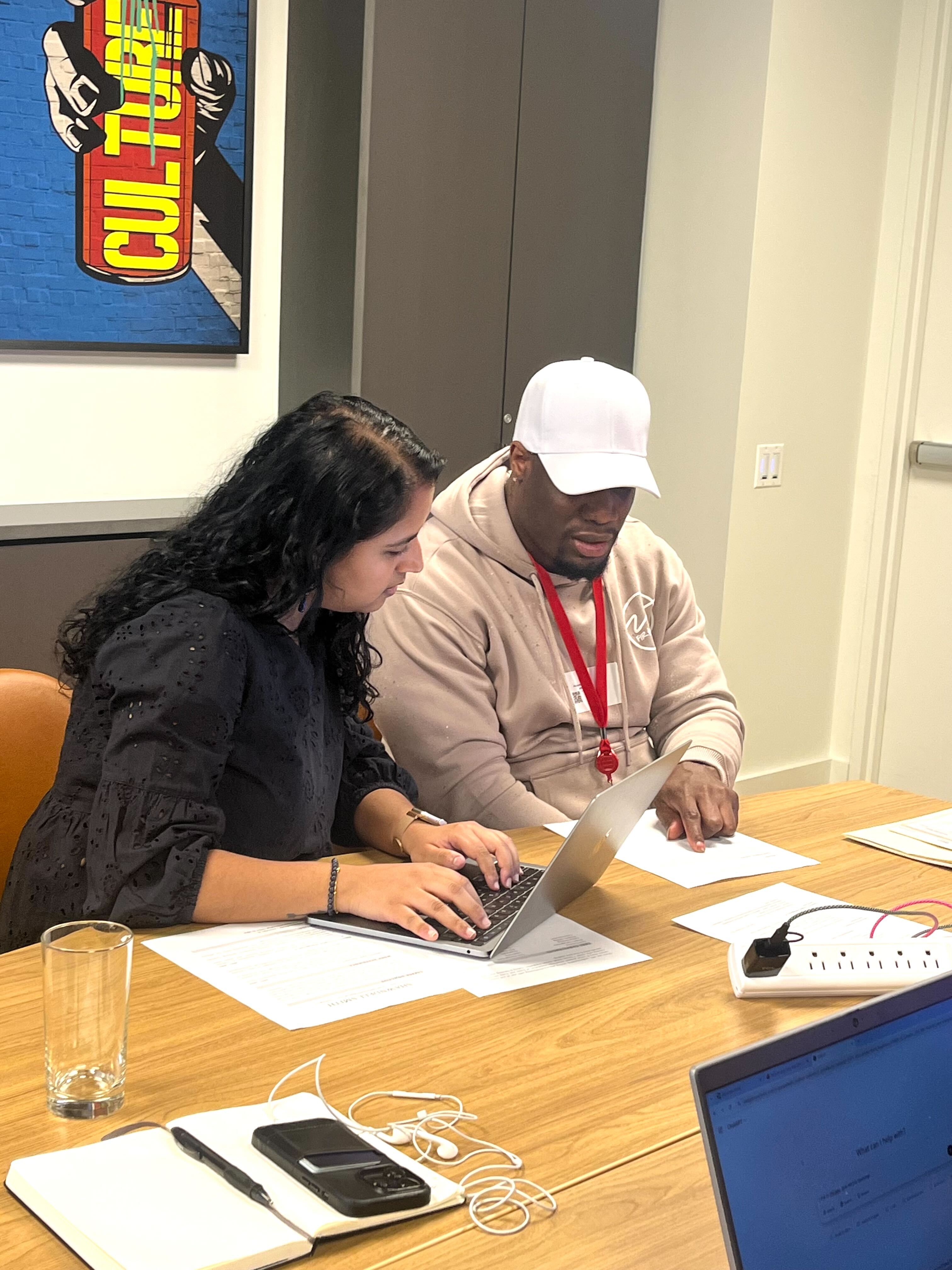 Back on My Feet program staff working one-on-one with a member on goal planning